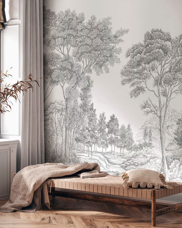 Interior with daybed, throw blanket, and forest mural wallpaper.