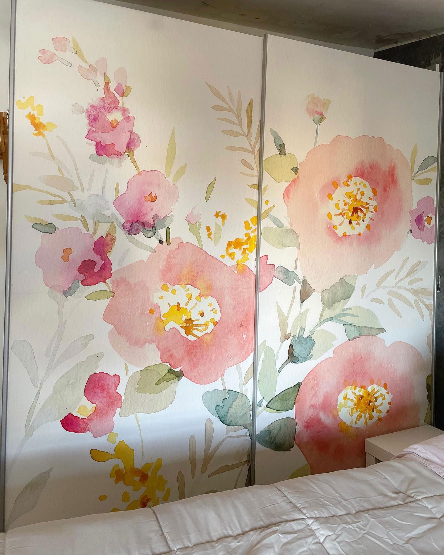 Bedroom closet doors with a pink floral watercolor design.