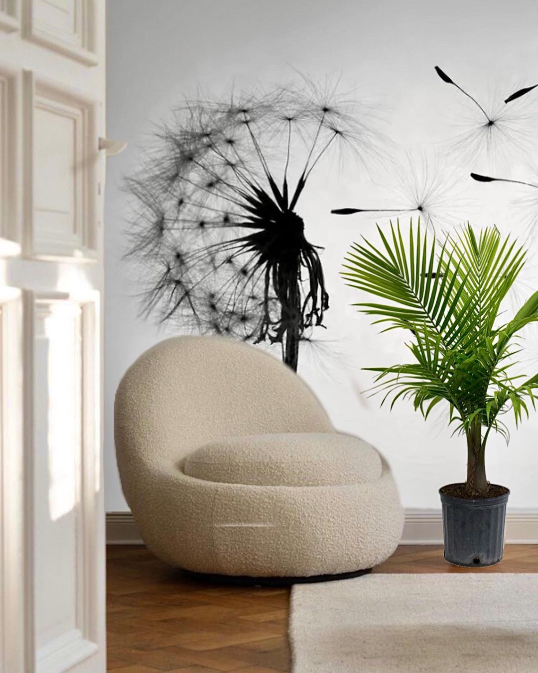 Interior with cream-colored sherpa swivel chair, potted palm, and dandelion wall art.