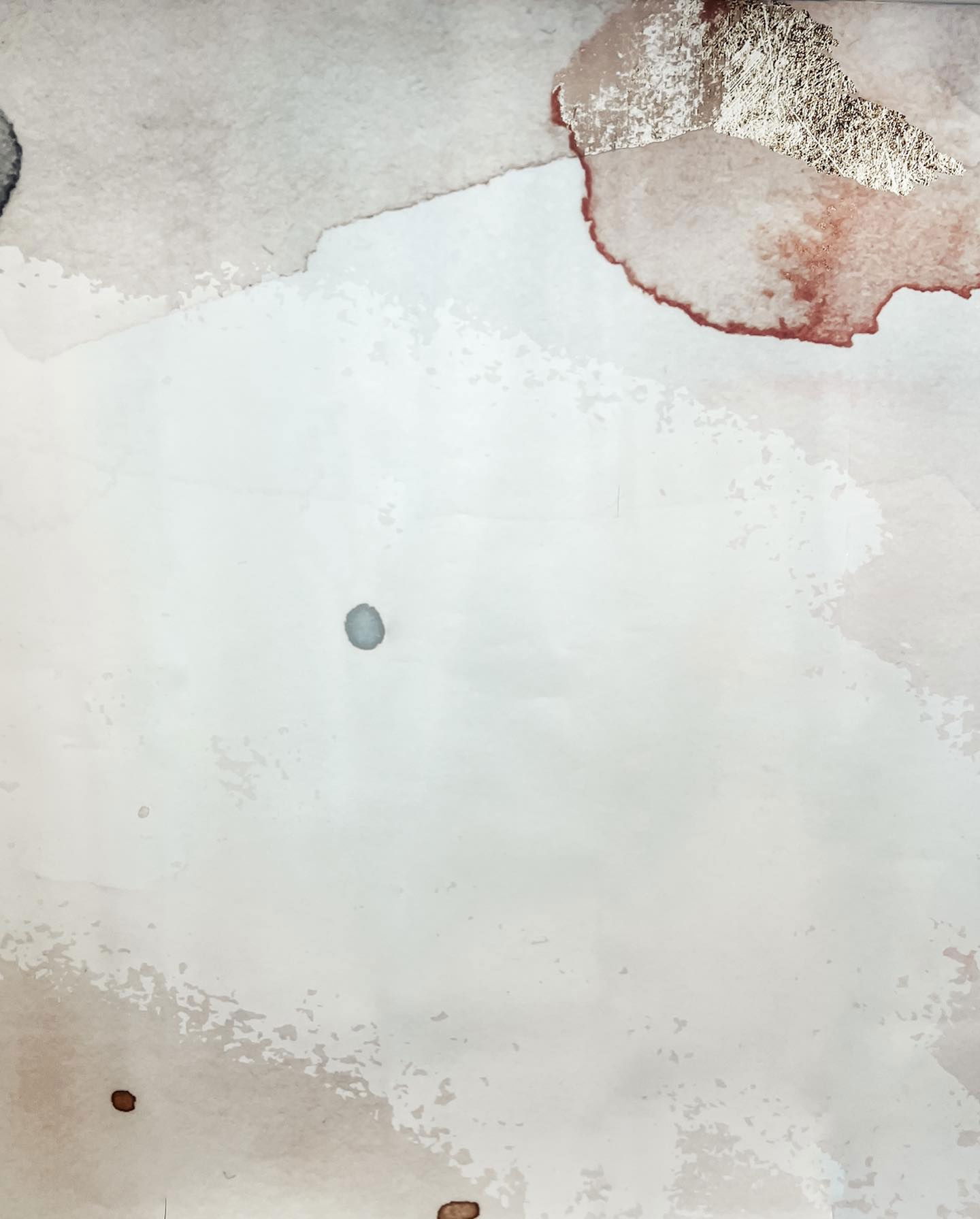 Abstract art with watercolor and gold leaf accents.