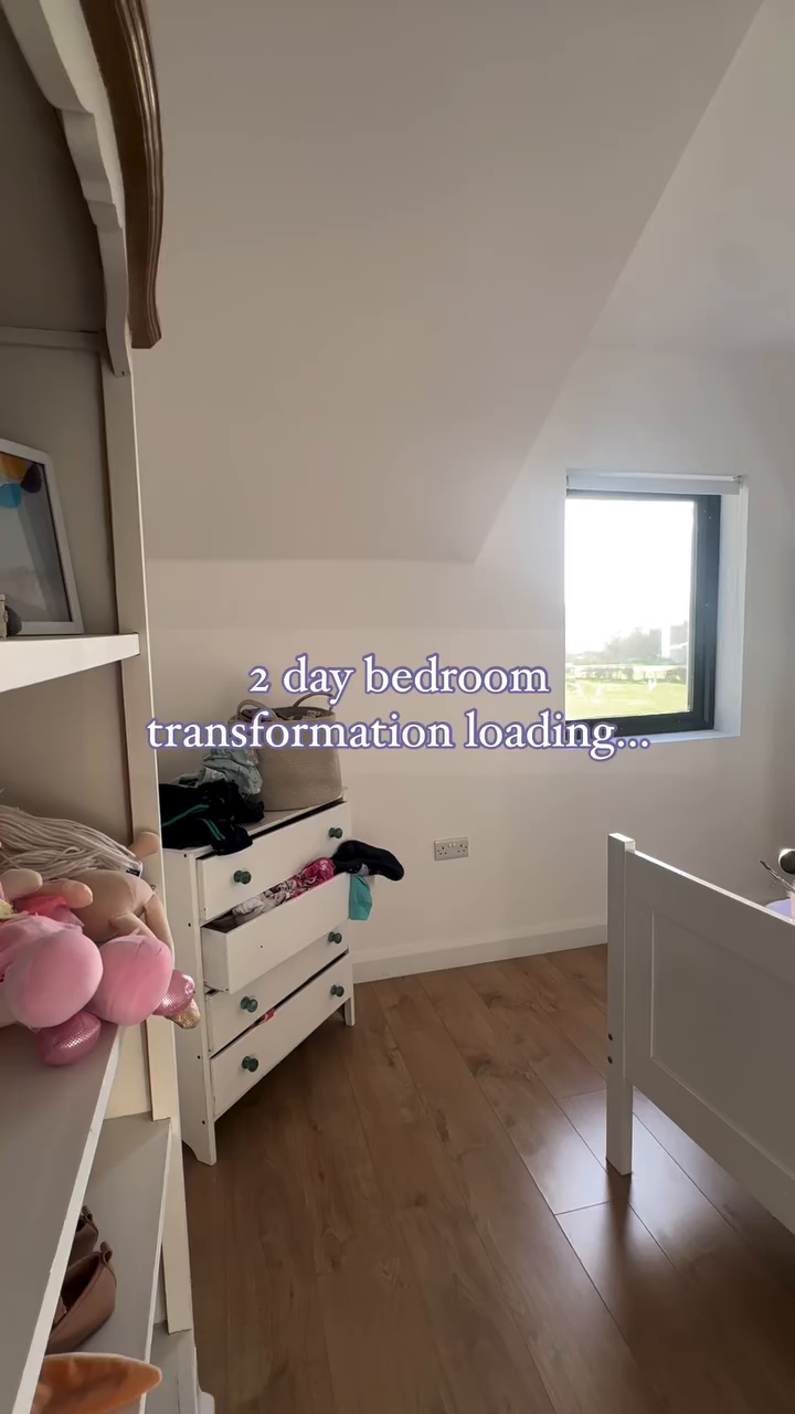 Bedroom interior with white walls, wood floor, and furniture. Text overlay: "2 day bedroom transformation loading..."