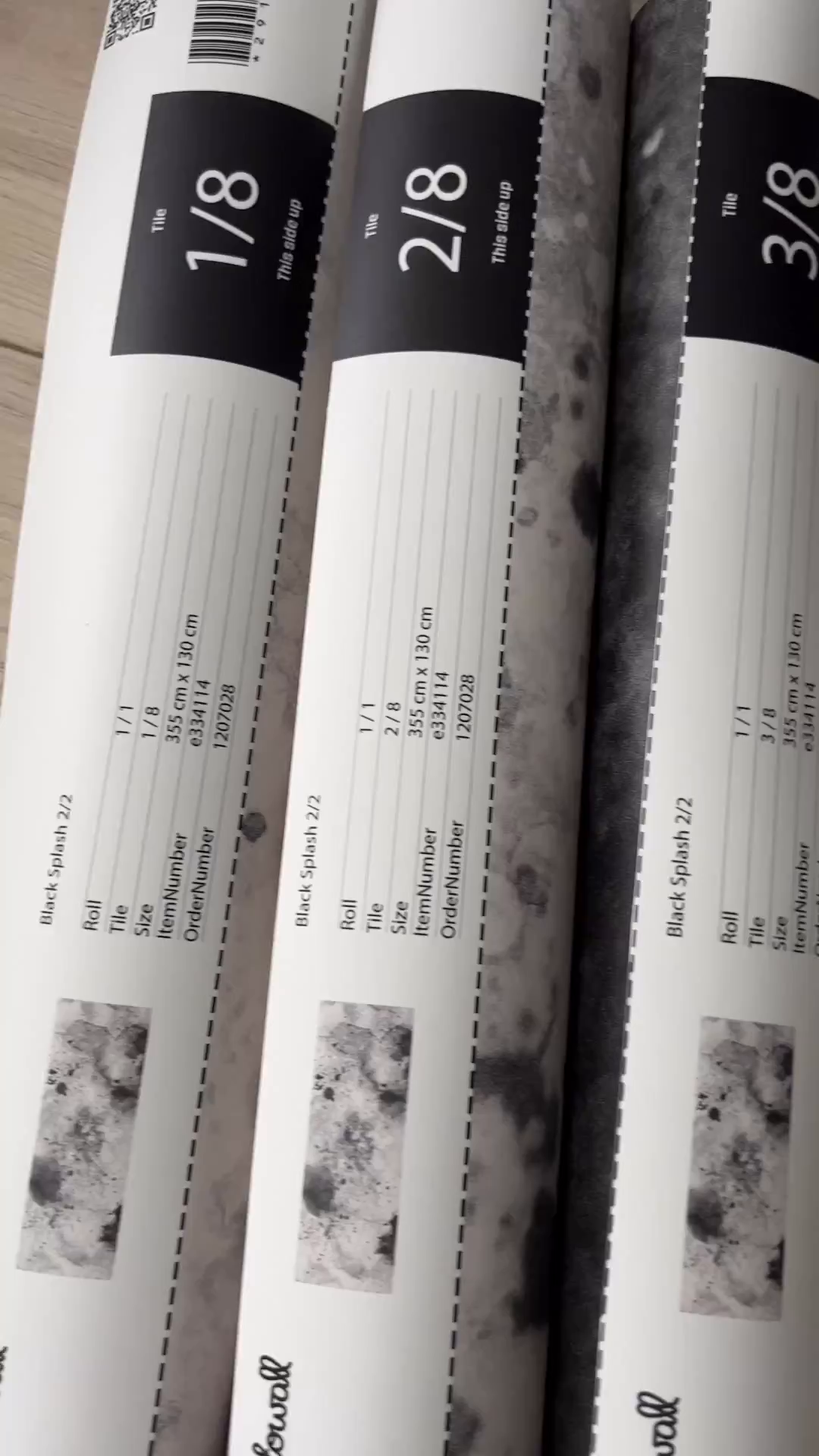 Three rolls of Photowall Black Splash 2/2 wallpaper tiles, sizes 1/8, 2/8, and 3/8.