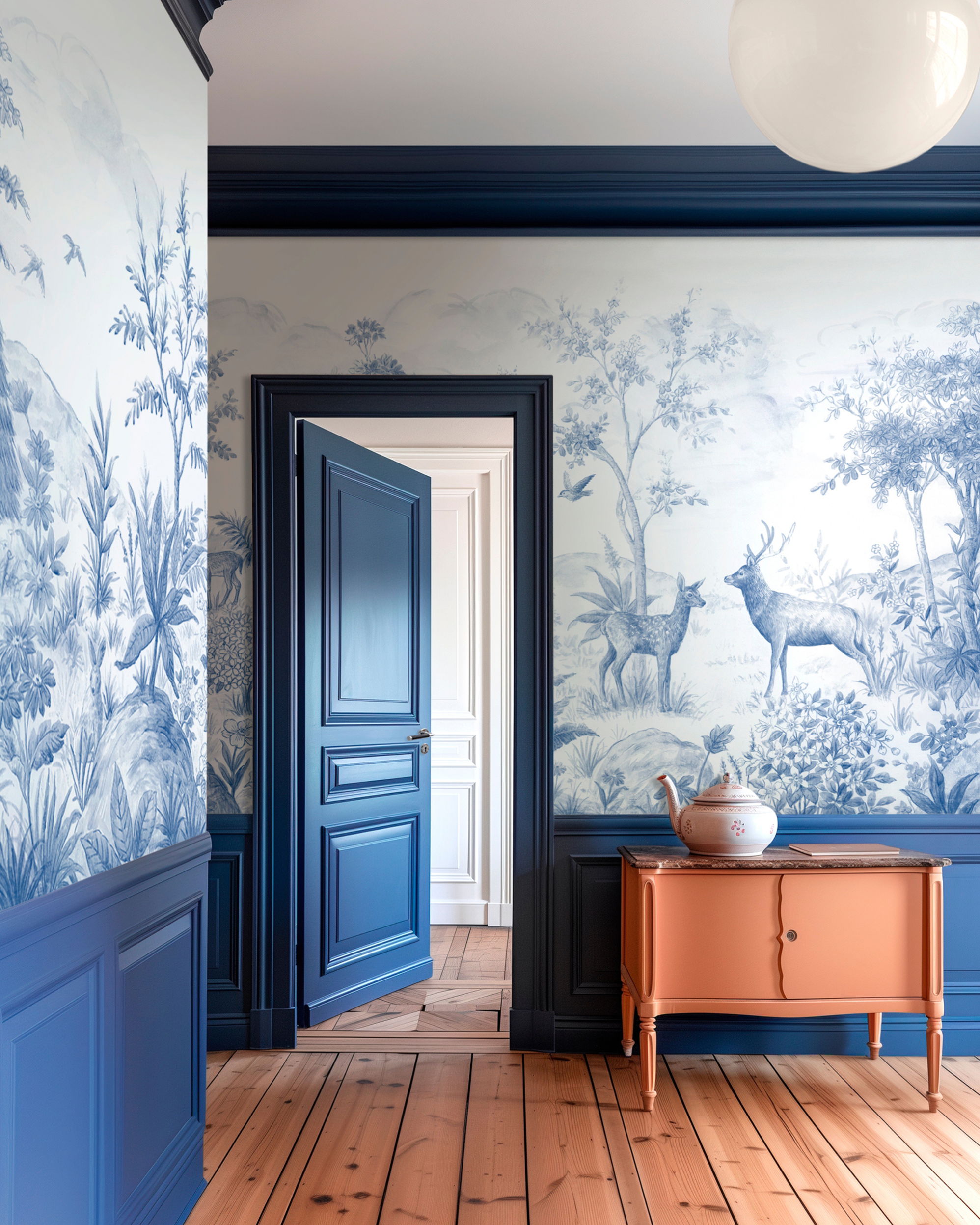 Hallway with blue and white toile wallpaper, blue trim, and a salmon-colored cabinet.