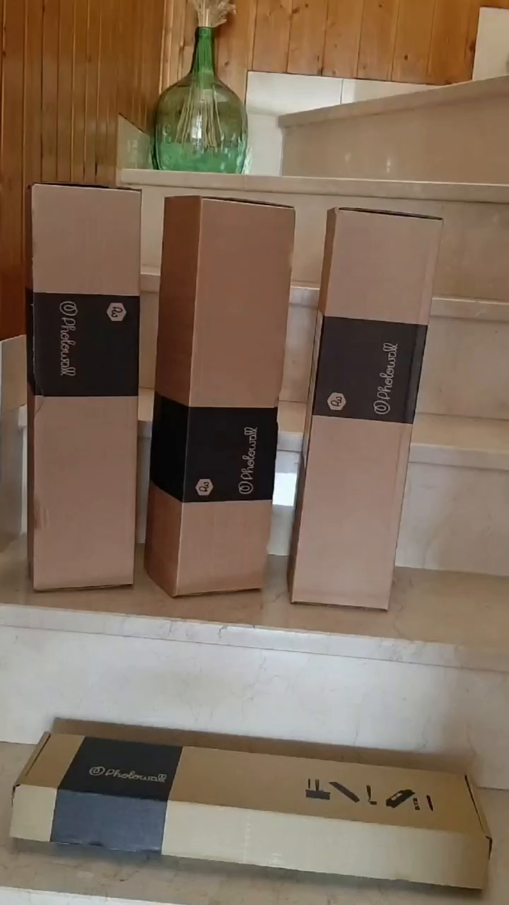 Four Photowall wallpaper boxes on stairs.