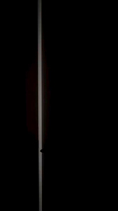 Ajar door with a sliver of light.