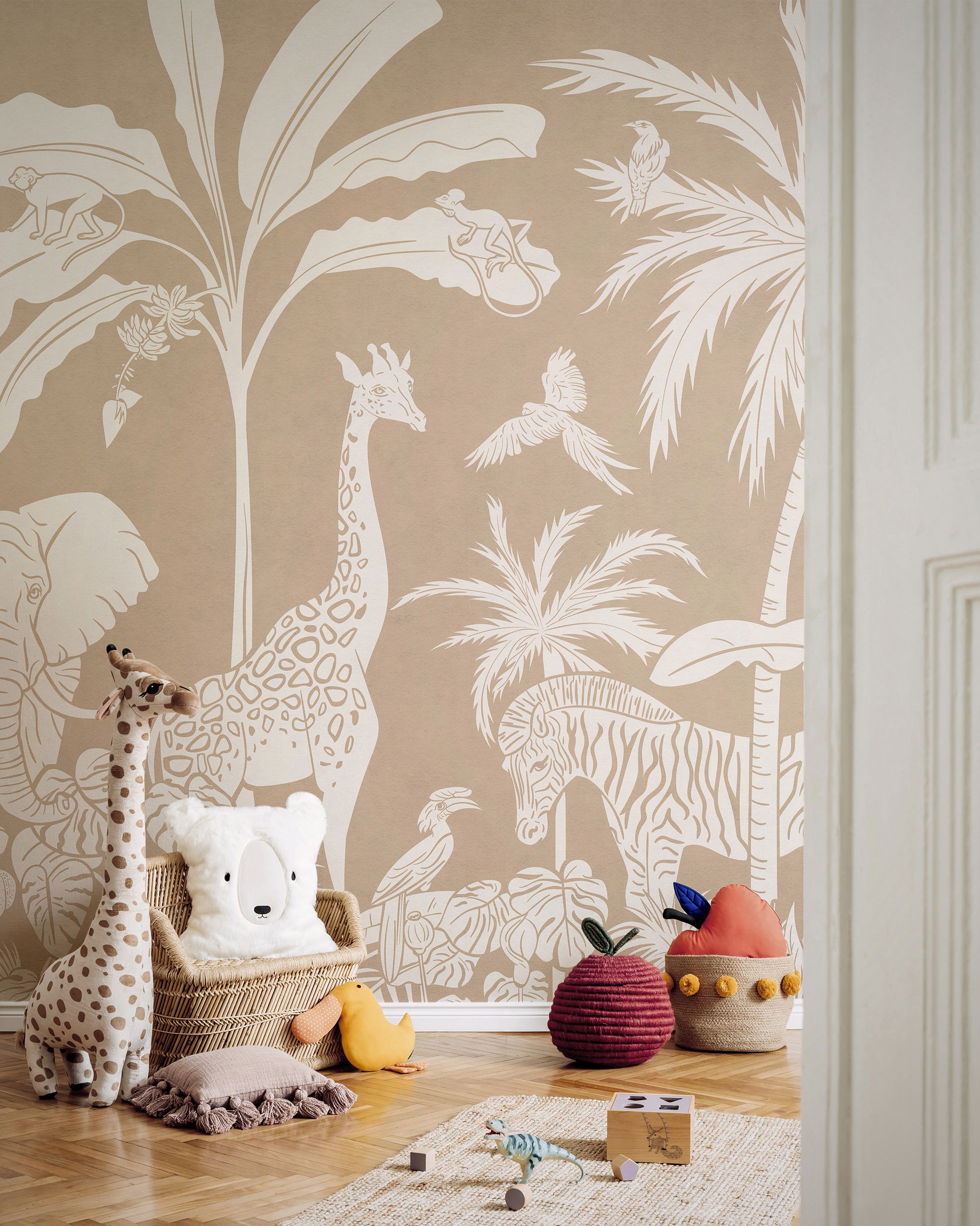 Child's room with jungle-themed wallpaper, stuffed giraffe, bear pillow in wicker chair, and toy fruit.